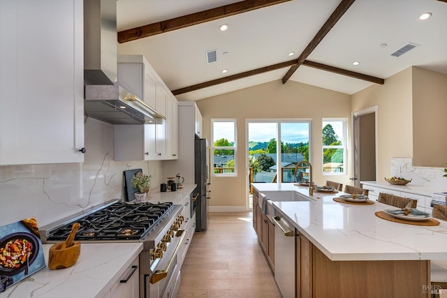 431 Seymour St, Napa, CA 94559 - kitchen with appliances with stainless steel finishes, wall chimney exhaust hood, a sink, light wood finished floors, and a spacious island