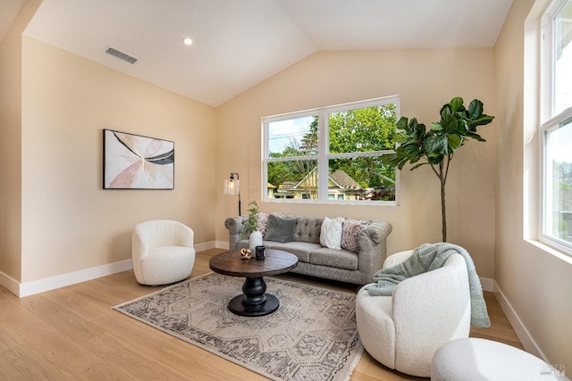 431 Seymour St, Napa, CA 94559 - living area with light wood finished floors, vaulted ceiling, and baseboards