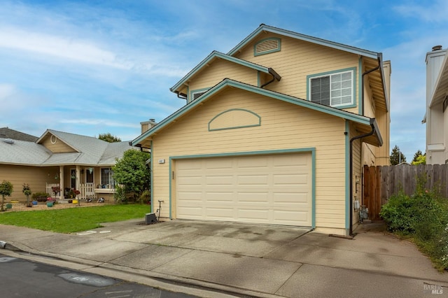 traditional home with fence, a chimney, a garage, and concrete driveway