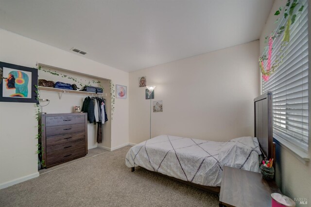 bedroom with baseboards, carpet flooring, and visible vents