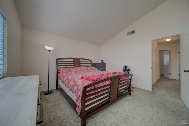 carpeted bedroom featuring vaulted ceiling, visible vents, and baseboards