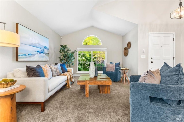 carpeted living room featuring lofted ceiling