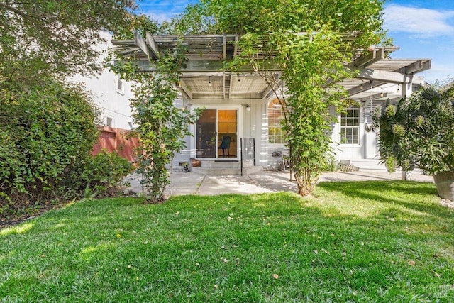 back of property featuring a pergola, a lawn, fence, a patio, and entry steps