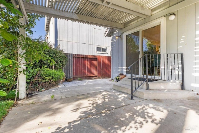 view of patio featuring fence