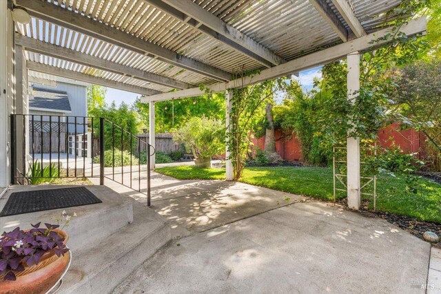 view of patio / terrace featuring a fenced backyard and a pergola