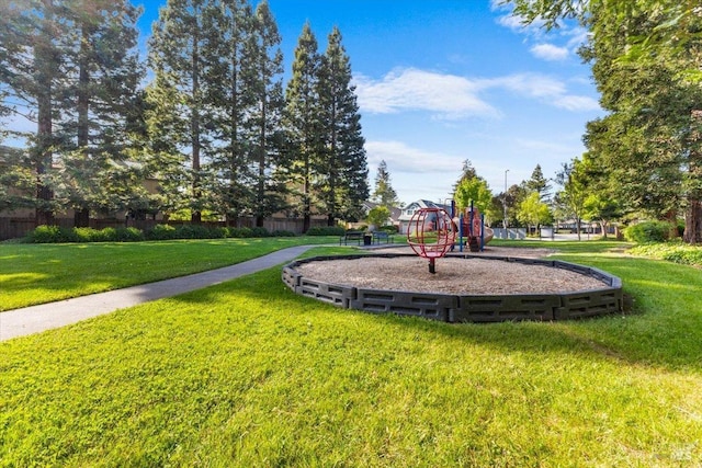 community playground featuring a lawn
