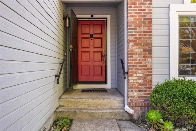 entrance to property with brick siding