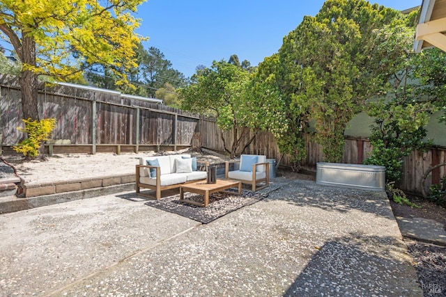 view of patio featuring a fenced backyard and an outdoor living space