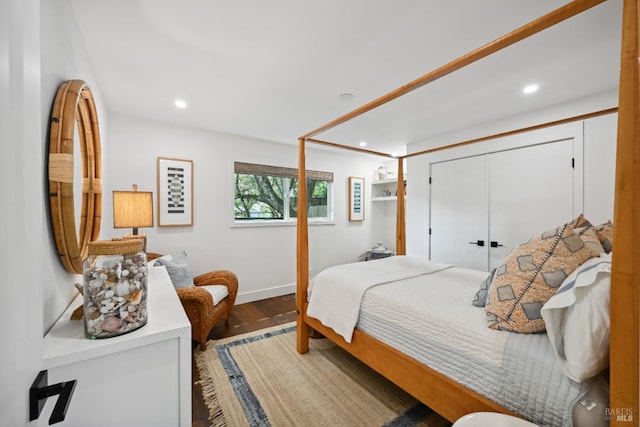 bedroom with baseboards, wood finished floors, and recessed lighting