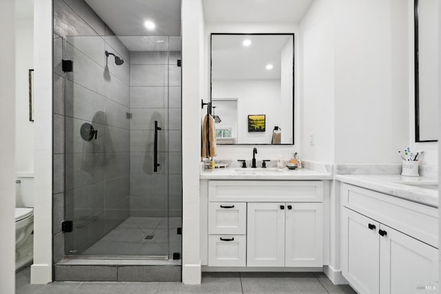 full bath featuring recessed lighting, a shower stall, toilet, and vanity