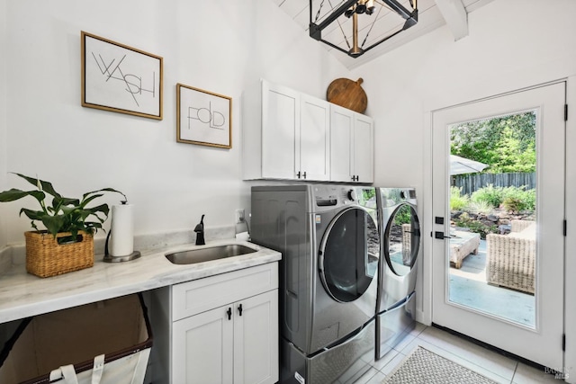 laundry room with separate washer and dryer, a sink, light tile patterned floors, and cabinet space