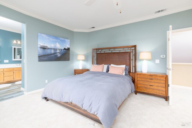 bedroom with visible vents, light colored carpet, ornamental molding, and ensuite bathroom