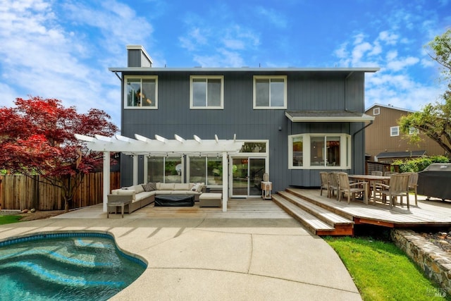rear view of house featuring a fenced in pool, fence, a pergola, an outdoor living space, and a deck