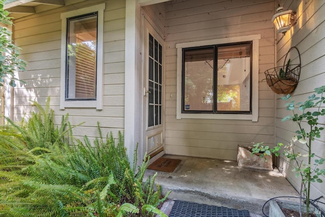 doorway to property with a patio area