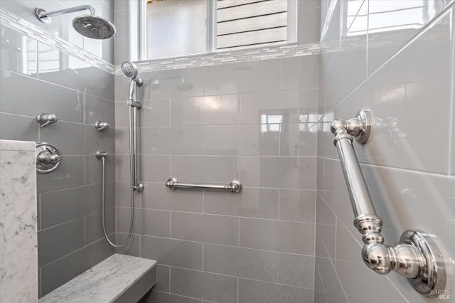 full bath featuring a tile shower