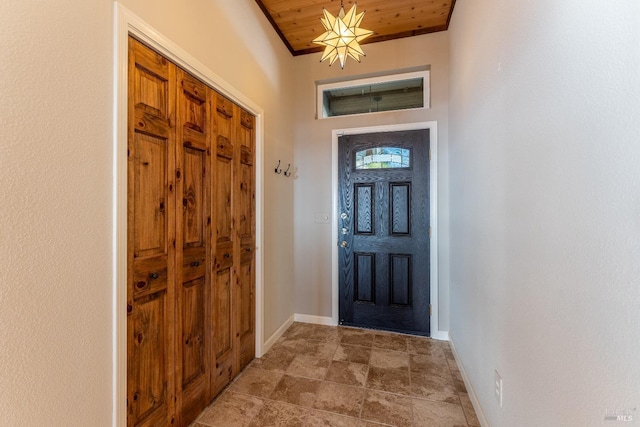 interior space with wooden ceiling and baseboards