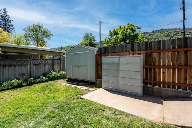 view of shed with fence