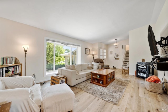1119 Clelia Ct, Petaluma, CA 94954 - living room featuring stairs, baseboards, and wood finished floors
