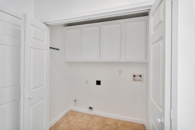 laundry room with hookup for a washing machine, electric dryer hookup, cabinet space, hookup for a gas dryer, and baseboards