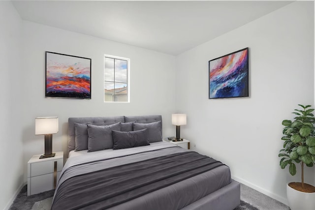 carpeted bedroom featuring baseboards