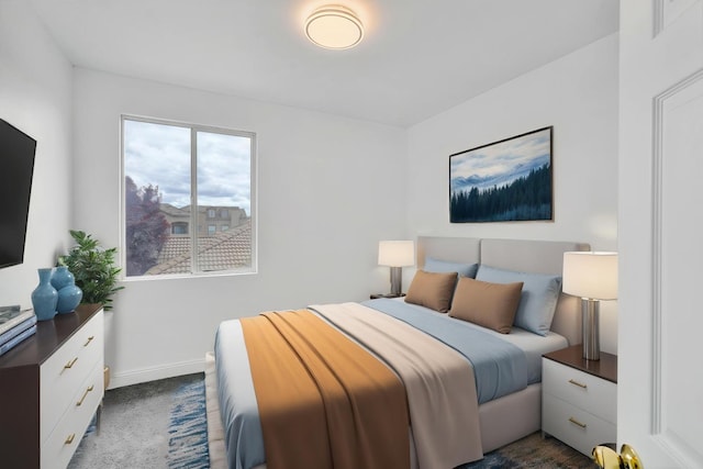 bedroom with baseboards and dark carpet