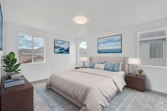 carpeted bedroom featuring baseboards