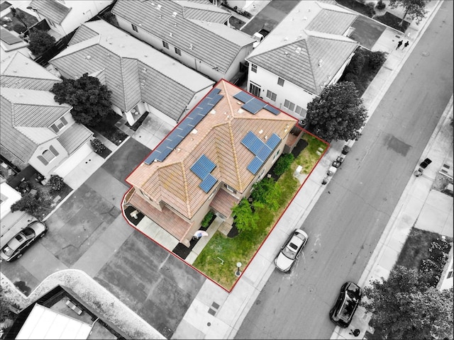 birds eye view of property with a residential view