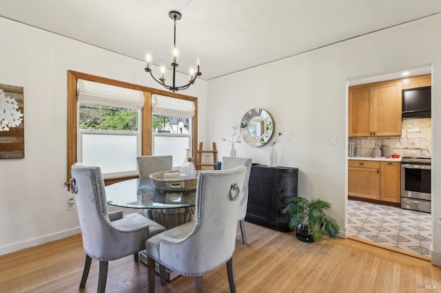 17 Hanns Ave, Vallejo, CA 94590 - dining space with light wood-type flooring, baseboards, and a notable chandelier