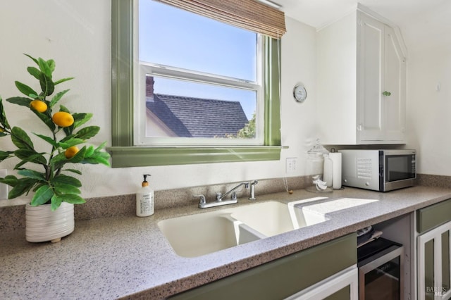 17 Hanns Ave, Vallejo, CA 94590 - interior details with stainless steel microwave, white cabinetry, light stone countertops, and a sink