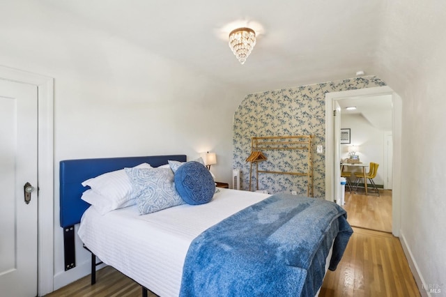 17 Hanns Ave, Vallejo, CA 94590 - bedroom with wallpapered walls, wood finished floors, lofted ceiling, and baseboards