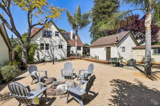 17 Hanns Ave, Vallejo, CA 94590 - back of house with stucco siding, an outdoor fire pit, and a deck