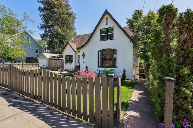 17 Hanns Ave, Vallejo, CA 94590 - english style home featuring roof with shingles, stucco siding, and fence