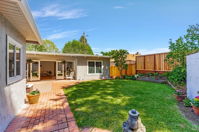 view of yard with a fenced backyard and a patio area