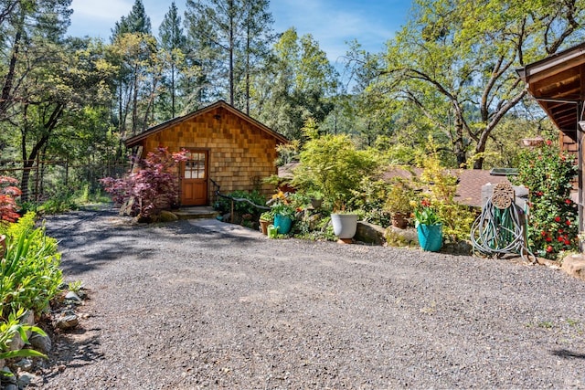 view of outbuilding with an outdoor structure and fence