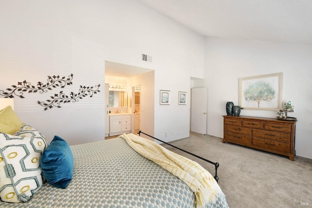 bedroom with visible vents, carpet floors, connected bathroom, and high vaulted ceiling