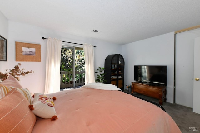 bedroom with visible vents and carpet flooring