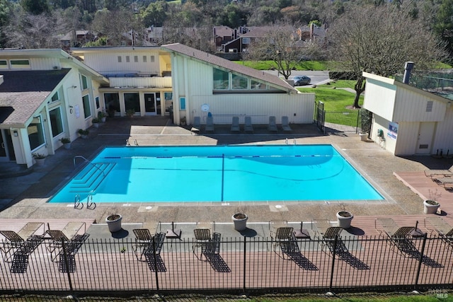 view of pool with a fenced in pool, a patio, and fence