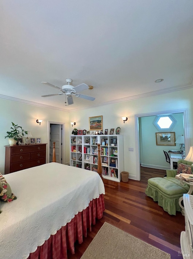 bedroom with baseboards, a ceiling fan, wood finished floors, and crown molding