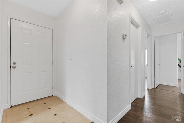 hallway featuring baseboards