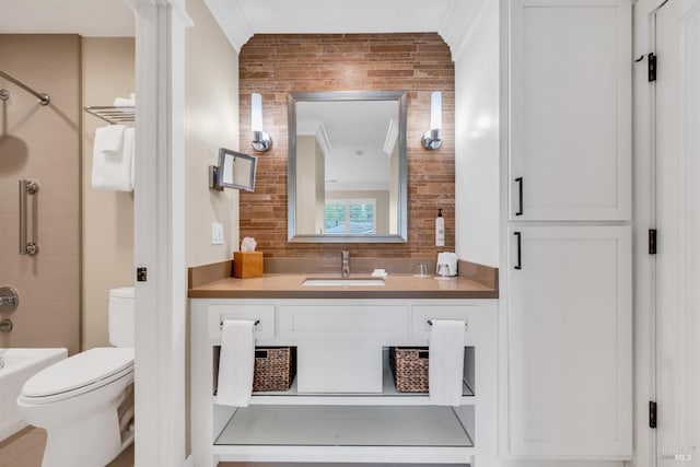 bathroom with backsplash, shower / bathing tub combination, toilet, and vanity