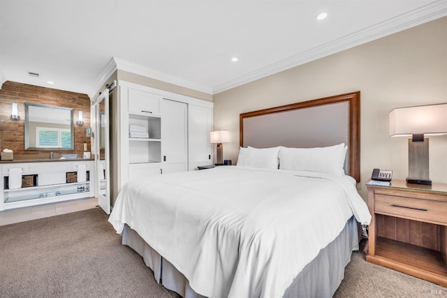 carpeted bedroom featuring a closet, crown molding, visible vents, and recessed lighting