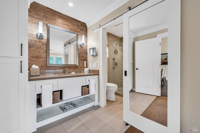 bathroom featuring toilet, tile patterned flooring, a shower stall, crown molding, and vanity