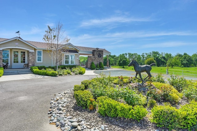 10240 Kost Rd, Galt, CA 95632 - view of front of home featuring french doors and stone siding