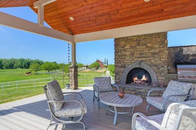 10240 Kost Rd, Galt, CA 95632 - deck with fence, a lawn, grilling area, and an outdoor stone fireplace