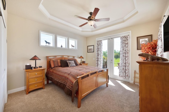 10240 Kost Rd, Galt, CA 95632 - bedroom featuring a tray ceiling, access to exterior, multiple windows, and light carpet