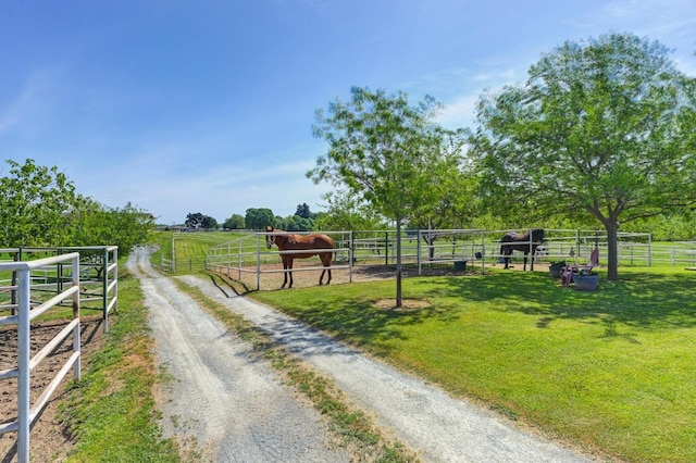 view of street with a rural view and an exterior structure