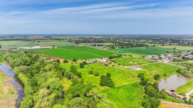 aerial view with a rural view and a water view