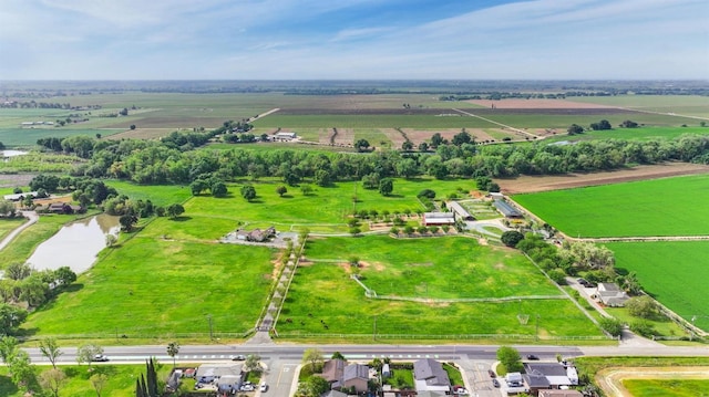 birds eye view of property with a rural view