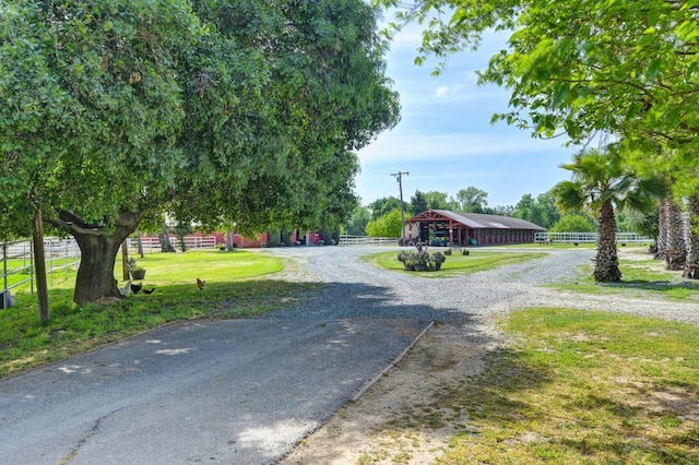 view of street with gravel driveway