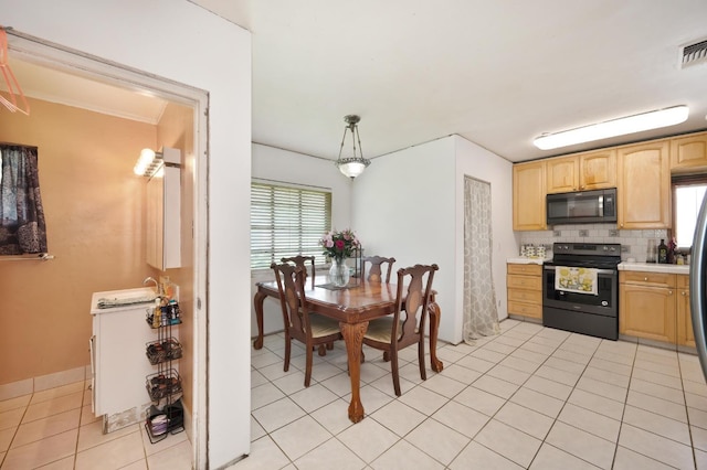 10240 Kost Rd, Galt, CA 95632 - kitchen with light countertops, light brown cabinets, black appliances, and a wealth of natural light